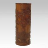 A Chinese carved bamboo brush pot, decorated with a still life of a vase of peonies,