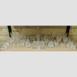 A collection of cut glass drinking glasses,