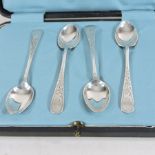 A set of four silver teaspoons, with bright cut decoration, by John Sanderson and Son Ltd,