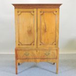A George III style walnut cabinet on stand, on square legs,