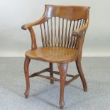 An early 20th century oak spindle back desk chair