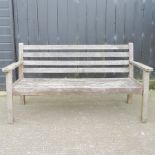A hardwood slatted wooden garden bench,