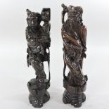 A pair of early 20th century Chinese carved rosewood and white metal inlaid figures,