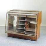 A mid-20th century shop display cabinet, fitted with drawers,