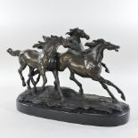 A bronze figure group of three horses, on a marble base,