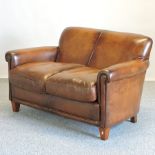 A Laura Ashley brown leather upholstered two seater sofa,