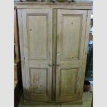 An antique pine armoire,