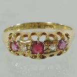 An 18 carat gold, ruby and diamond ring,