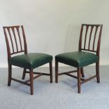 A set of eight 19th century mahogany dining chairs, with green padded seats,