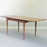 A 1960's teak draw-leaf dining table,