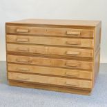 A mid-20th century light oak plan chest, in two halves,