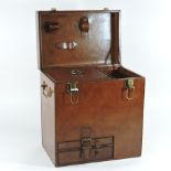 A brown leather champagne hamper, with a fitted interior,