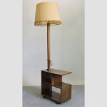 An Art Deco walnut standard lamp, on a bookcase stand,