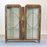 A 1930's walnut and chinoiserie decorated china cabinet,