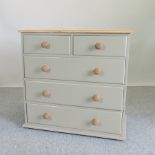 A green painted and pine chest of drawers