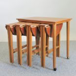 A 1970's nest of folding occasional tables,