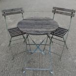 A hardwood slatted and painted metal bistro table, 60cm diameter,