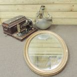 An oval gilt framed wall mirror, 85 x 60cm,