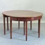 A pair of George III mahogany D shaped side tables, on square legs,