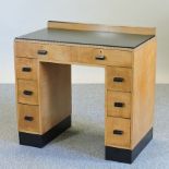 An Art Deco maple and ebonised pedestal desk, by Bath cabinet makers,