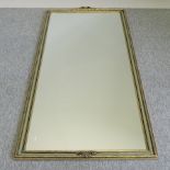 A painted and gilt framed wall mirror,