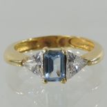 An 18 carat gold topaz and gem set ring,