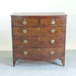 A Regency mahogany bow front chest, of two short over three long drawers, on bracket feet,