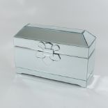 A mirrored casket, with a hinged lid,