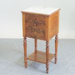 A 19th century French walnut marble top pot cupboard, on fluted legs,