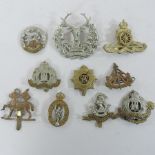 A collection of various military cap badges