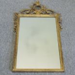 A carved and gilt framed wall mirror,