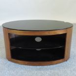 An oval side cabinet with a glass top,