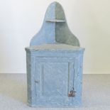 A marble effect painted corner cabinet,