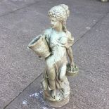 A reconstituted stone garden figure of a lady,