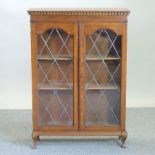 An early 20th century oak lead glazed bookcase,