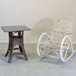 A white painted bamboo rocking chair,