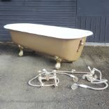 An antique cast iron roll top bath, 180 x 75cm,