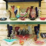 Two shelves of art glass and coloured glass,