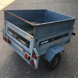 A Daxon 127 galvanised car trailer, with cover,