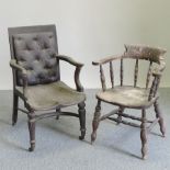 A 19th century black upholstered elbow chair,