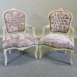 A pair of cream painted and velvet upholstered open armchairs