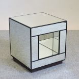 An Andrew Martin style cube mirrored occasional table,