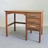 A mid 20th century teak desk,