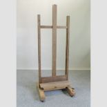 An early 20th century oak easel,