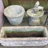 A reconstituted stone trough,