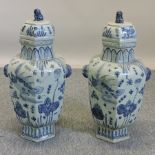 A pair of Chinese porcelain blue and white jars and covers,