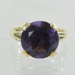 An 18 carat gold and topaz ring,