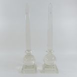 A pair of glass obelisks,