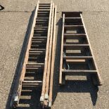 A set of three wooden ladders, largest 205cm,