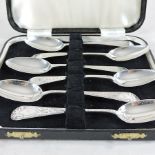 A matched set of six George III silver bright cut spoons, with bright cut decoration,